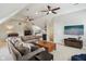 Large, carpeted, upstairs living room with modern ceiling fans and neutral-toned decor at 1616 N Delaware St, Indianapolis, IN 46202