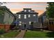 Rear exterior featuring a patio set, a hammock, and privacy from the surrounding homes because of the fencing at 1616 N Delaware St, Indianapolis, IN 46202