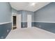 Comfortable bedroom with neutral carpet, chair railing, and multiple doors at 16768 Maraschino Dr, Noblesville, IN 46062