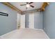 Bedroom featuring decorative wooden shelving, neutral carpet, and multiple doors at 16768 Maraschino Dr, Noblesville, IN 46062