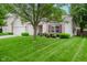 Lovely single-story home with a well-maintained lawn, attached garage, and cozy front seating area at 16768 Maraschino Dr, Noblesville, IN 46062
