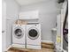 Functional laundry room featuring white appliances and storage space for laundry needs at 16768 Maraschino Dr, Noblesville, IN 46062