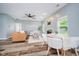 Spacious living room and dining area with modern furniture, fireplace, plenty of natural light and wood flooring at 16768 Maraschino Dr, Noblesville, IN 46062