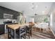 Open concept kitchen and dining area with wood floors and natural light throughout the adjoining living space at 16768 Maraschino Dr, Noblesville, IN 46062