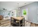 Bright open-concept living area with wood floors, modern furnishings, dining area, and plenty of natural light at 16768 Maraschino Dr, Noblesville, IN 46062