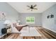 Bright main bedroom with wood floors, windows, ceiling fan, and neutral decor creating a tranquil retreat at 16768 Maraschino Dr, Noblesville, IN 46062