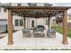 Inviting backyard patio with comfortable seating under a stylish pergola, ideal for outdoor relaxation and entertainment at 1680 Arbor Springs Dr, Brownsburg, IN 46112