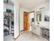 Bright bathroom features a large vanity, storage, and a walk-in closet offering a spacious and functional layout at 1680 Arbor Springs Dr, Brownsburg, IN 46112