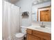Cozy bathroom featuring a classic vanity, toilet, and shower with curtain, offering a functional and traditional space at 1680 Arbor Springs Dr, Brownsburg, IN 46112