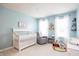 Bright Bedroom with natural light, a crib, and a cozy chair creating a serene and comfortable space for baby at 1680 Arbor Springs Dr, Brownsburg, IN 46112