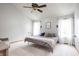 Well-lit bedroom with soft carpet, ceiling fan, and comfortable decor creating a welcoming and relaxing space at 1680 Arbor Springs Dr, Brownsburg, IN 46112