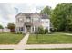 Inviting two-story home featuring a brick facade, well-maintained lawn, and established landscaping at 1680 Arbor Springs Dr, Brownsburg, IN 46112