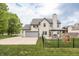 Charming home with a spacious driveway, two-car garage, basketball hoop, and backyard gazebo, perfect for Gathering living at 1680 Arbor Springs Dr, Brownsburg, IN 46112