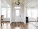 Bright foyer with dark wood floors, white trim and natural light at 1680 Arbor Springs Dr, Brownsburg, IN 46112