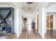 Hallway features dark wood floors and white trim at 1680 Arbor Springs Dr, Brownsburg, IN 46112