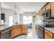 Spacious kitchen featuring wood cabinets, stainless steel appliances and lots of natural light at 1680 Arbor Springs Dr, Brownsburg, IN 46112
