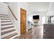 Living Room featuring fireplace, staircase, and stylish decor at 1680 Arbor Springs Dr, Brownsburg, IN 46112
