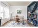Well-lit home office with stylish desk, rug and custom shelving at 1680 Arbor Springs Dr, Brownsburg, IN 46112