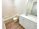 Bright bathroom featuring a bathtub, toilet, and vanity with modern fixtures at 1726 Creekside W Ln, Carmel, IN 46032