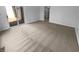 Bare bedroom with neutral carpet and a sliding glass door that provides access to a deck at 1726 Creekside W Ln, Carmel, IN 46032