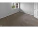 Simple bedroom with neutral carpet, white walls, and a window offering natural light at 1726 Creekside W Ln, Carmel, IN 46032