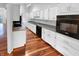Modern kitchen features white cabinets, sleek countertops, and stainless steel appliances at 1726 Creekside W Ln, Carmel, IN 46032