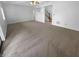 Spacious living room with plush carpeting and staircase at 1726 Creekside W Ln, Carmel, IN 46032