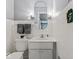 Bright bathroom featuring white tile, vanity, and a large mirror for a clean, modern feel at 1817 Edgewood Dr, Anderson, IN 46011