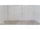 This bedroom offers a spacious closet with sliding doors and neutral carpeting at 1817 Edgewood Dr, Anderson, IN 46011