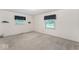 This bedroom features two windows for natural light and neutral carpeting at 1817 Edgewood Dr, Anderson, IN 46011