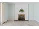 Living room fireplace features painted brick, hearth and mantle at 1817 Edgewood Dr, Anderson, IN 46011