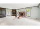 Spacious living room features built-in shelving and a cozy brick fireplace, great for relaxation and entertaining at 1817 Edgewood Dr, Anderson, IN 46011