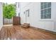 A wooden back deck with steps leading down, with a side entrance and a fenced in yard at 1825 E Maryland St, Indianapolis, IN 46201