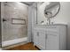 Elegant bathroom featuring a modern vanity, sleek fixtures, and a tiled shower for a luxurious experience at 1825 E Maryland St, Indianapolis, IN 46201