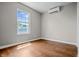 Bedroom with new hardwood floors, mini split AC, and double hung windows at 1825 E Maryland St, Indianapolis, IN 46201