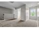 Bonus room featuring an open layout, natural light, and plush carpeting at 1825 E Maryland St, Indianapolis, IN 46201