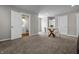 Bright dining area with a round glass table and four chairs near a bathroom; great for Gathering meals at 1825 E Maryland St, Indianapolis, IN 46201
