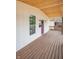 Stylish front porch with wood deck, modern purple door, and decorative exterior touches at 1825 E Maryland St, Indianapolis, IN 46201