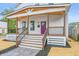 Inviting front porch with stylish railings, a modern door, and outdoor lighting fixtures at 1825 E Maryland St, Indianapolis, IN 46201