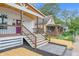 Well-designed front porch with wood railings, decorative accents, and exterior home details at 1825 E Maryland St, Indianapolis, IN 46201