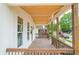 Inviting covered porch with wood flooring, stylish railings, and neighborhood views at 1825 E Maryland St, Indianapolis, IN 46201