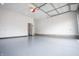 Spacious garage featuring epoxy flooring, ample lighting and white walls at 1825 E Maryland St, Indianapolis, IN 46201