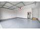 Epoxy garage floor with mini-split, water heater, and access door at 1825 E Maryland St, Indianapolis, IN 46201