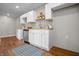 Modern kitchen featuring stainless steel appliances, white cabinets, and butcher block countertops at 1825 E Maryland St, Indianapolis, IN 46201