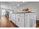 Spacious kitchen island with marble countertop and custom cabinetry, ideal for meal preparation and casual dining at 1825 E Maryland St, Indianapolis, IN 46201