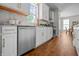 Well-lit kitchen features stainless steel appliances, white cabinets, and a large window, offering ample counter space at 1825 E Maryland St, Indianapolis, IN 46201