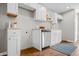 Modern kitchen featuring stainless steel appliances, white cabinets, and butcher block countertops at 1825 E Maryland St, Indianapolis, IN 46201