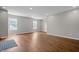 Bright and airy living room featuring hardwood floors, fresh paint, and recessed lighting at 1825 E Maryland St, Indianapolis, IN 46201