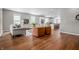 Bright, open-concept living room featuring hardwood floors and modern furnishings at 1825 E Maryland St, Indianapolis, IN 46201