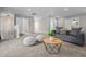 Open living room layout featuring a plush sofa and a modern coffee table; ideal for relaxation and gatherings at 1825 E Maryland St, Indianapolis, IN 46201